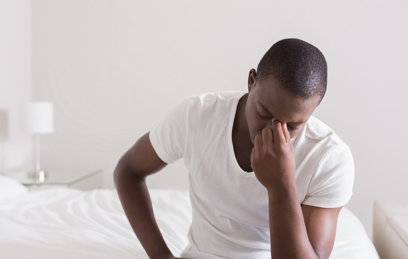 man who is hungover and is need of hangover iv therapy